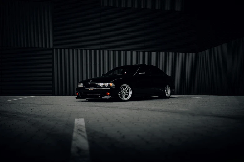 a car parked in a parking lot at night