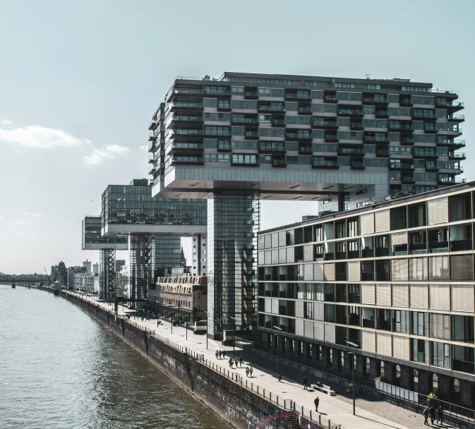 a long row of large tall buildings sitting above water