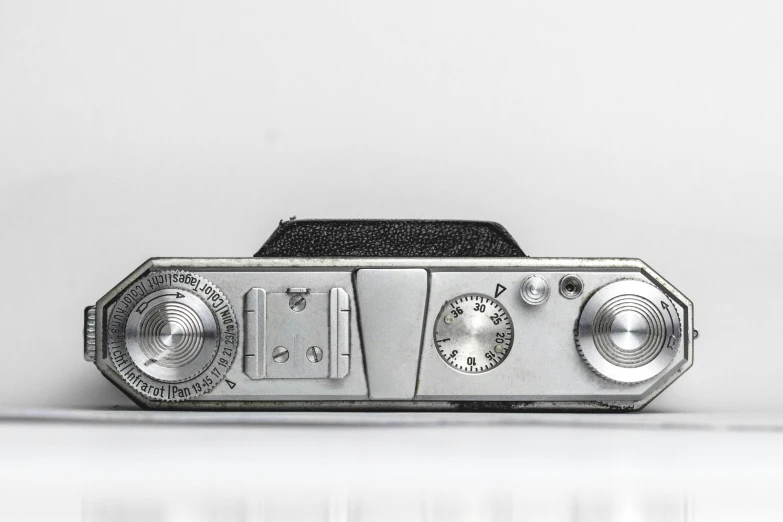 a vintage radio sitting in front of a white background