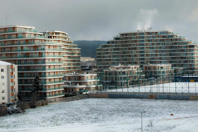 there are many buildings on the snow covered ground