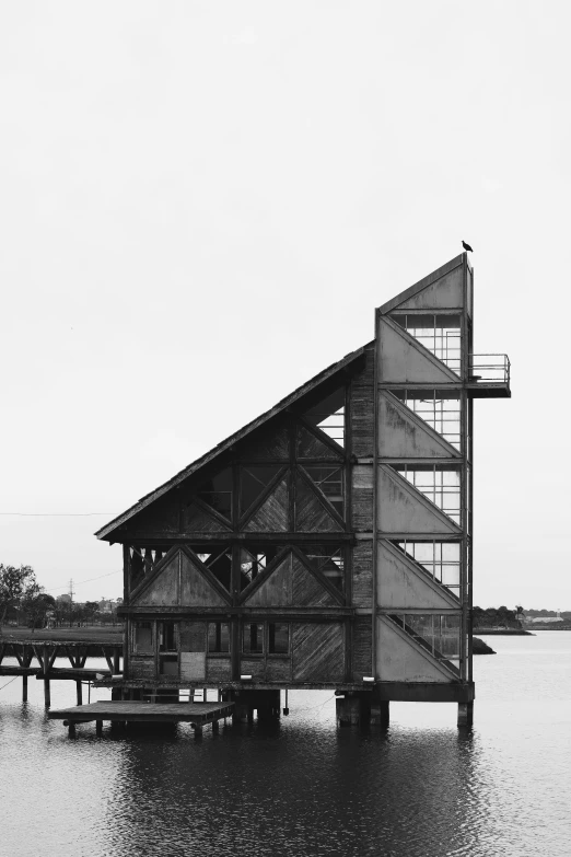 black and white pograph of a building in water