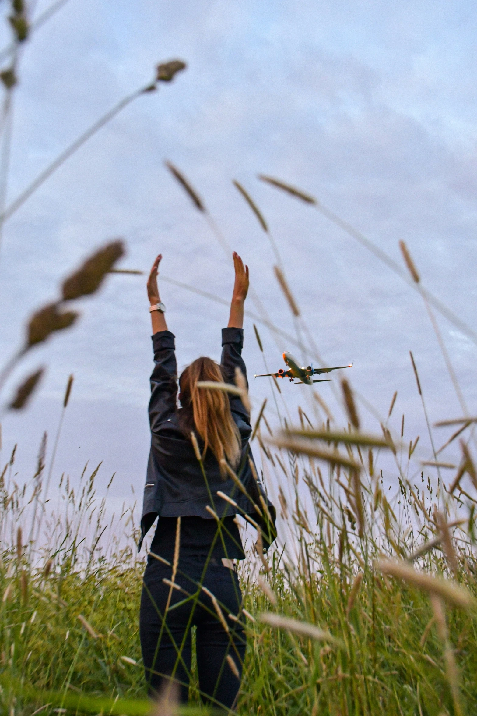 woman raising hands to show air force