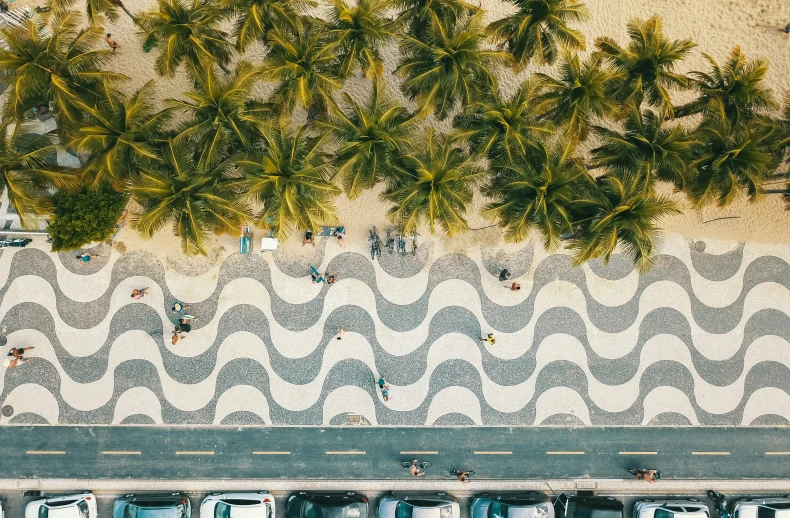 an overhead view of a parking lot with a few cars