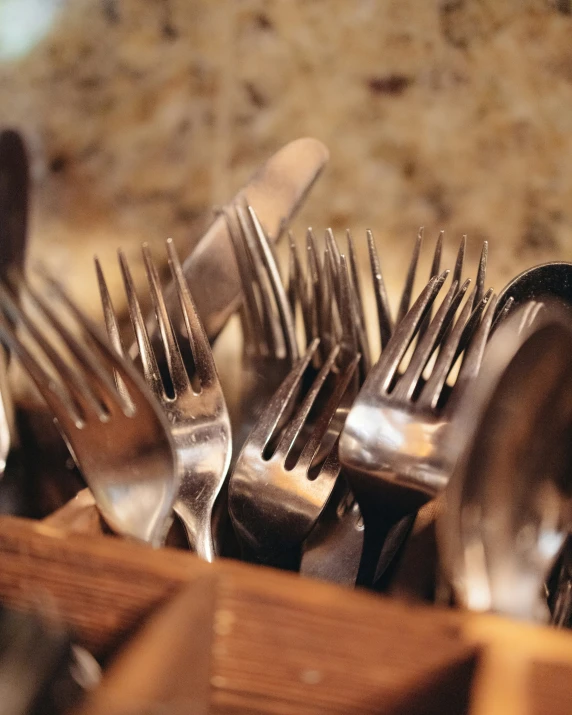 lots of forks on wooden boards and forks with forks in it