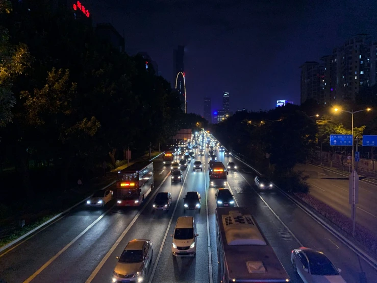 a long road filled with lots of traffic at night