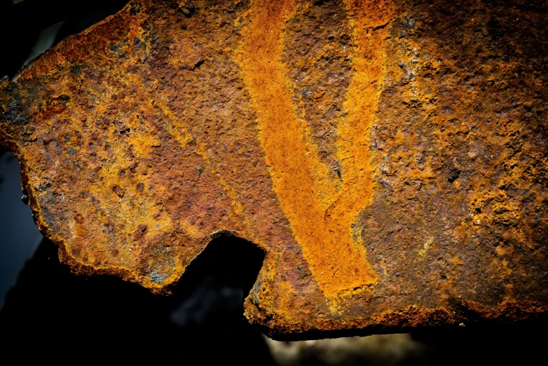 an image of a piece of metal that is rusty