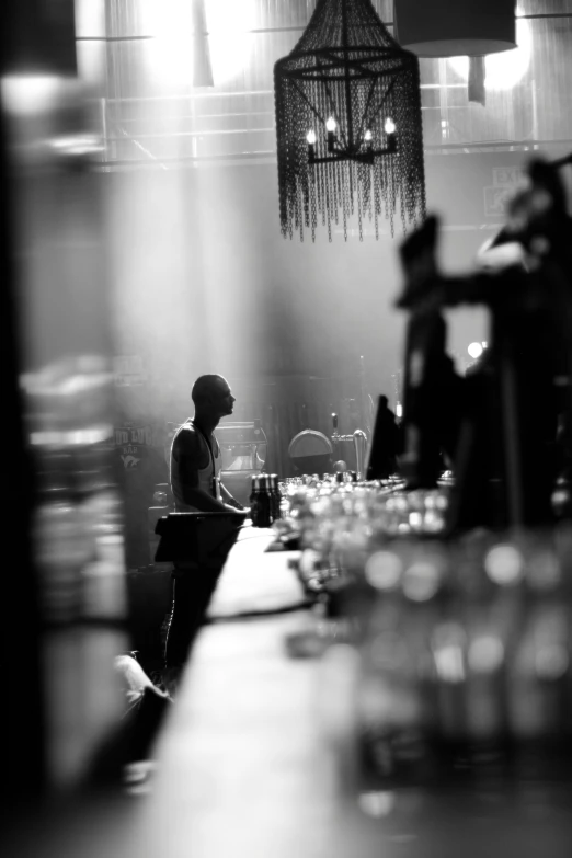 a woman is standing at a counter alone