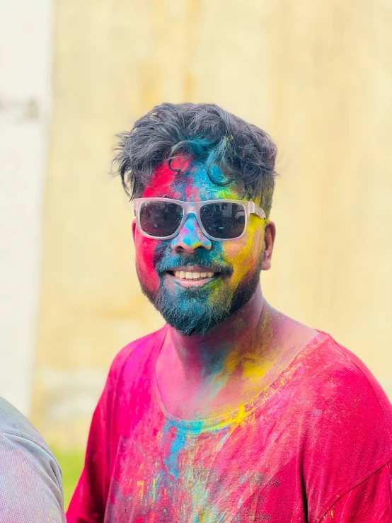 a man with beard and sunglasses painted in bright colors