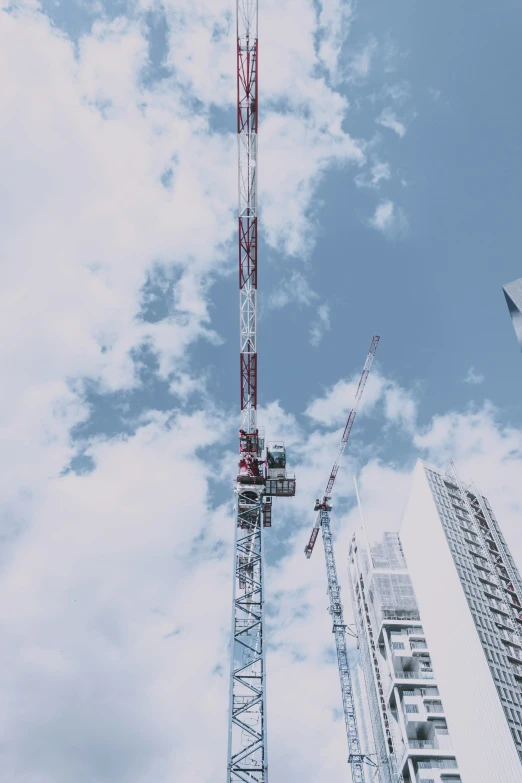 an observation tower on the construction site with blue sky