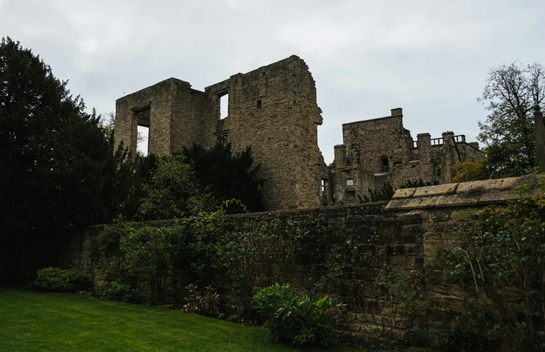 a castle that is surrounded by bushes and trees