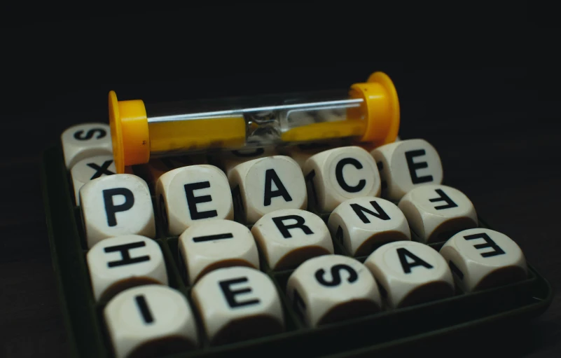 a pill and a word spelled in blocks to spell peace