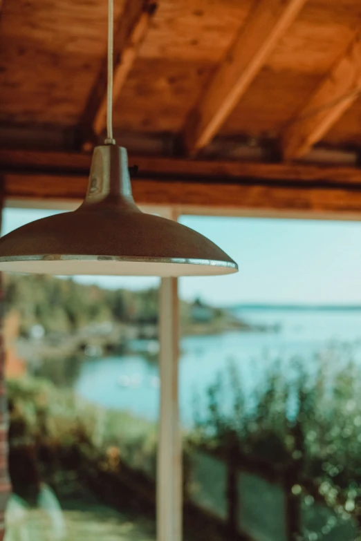 a view of the water from a covered outdoor space