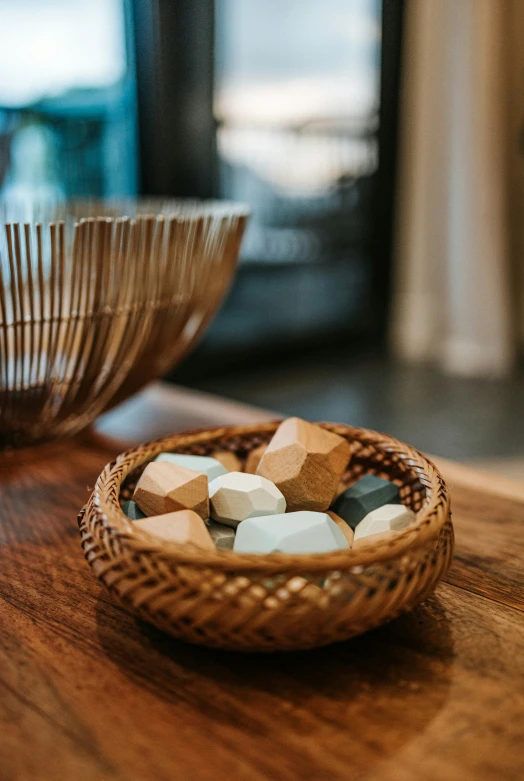 some wood is on the table with some plates and bowls