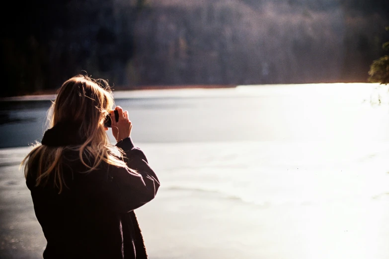 woman on the phone on a boat in a body of water