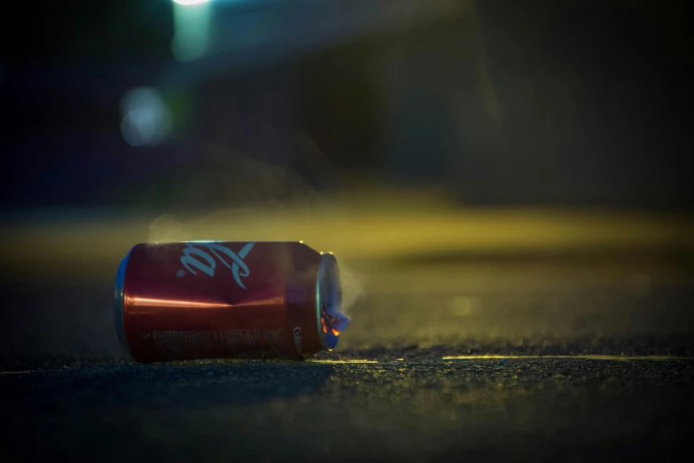 an empty can on a street at night