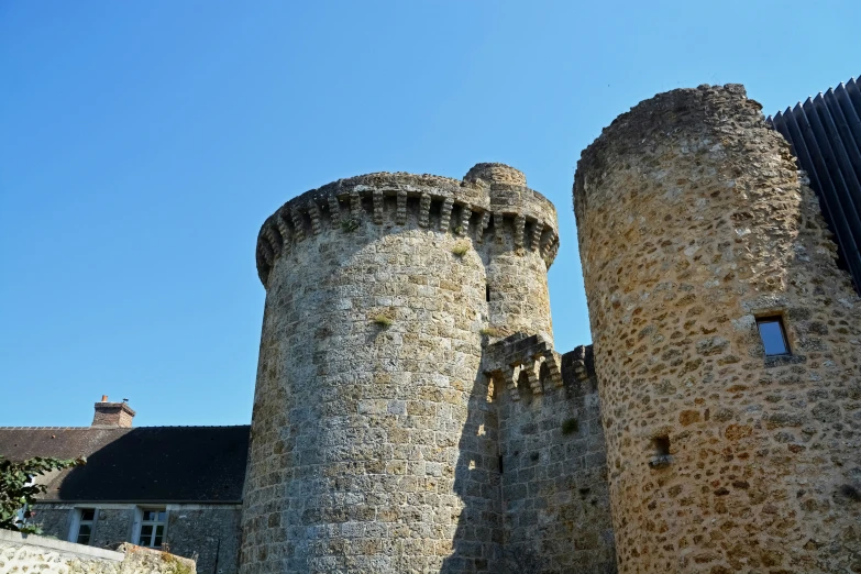 an old castle made of stone is pictured in the background