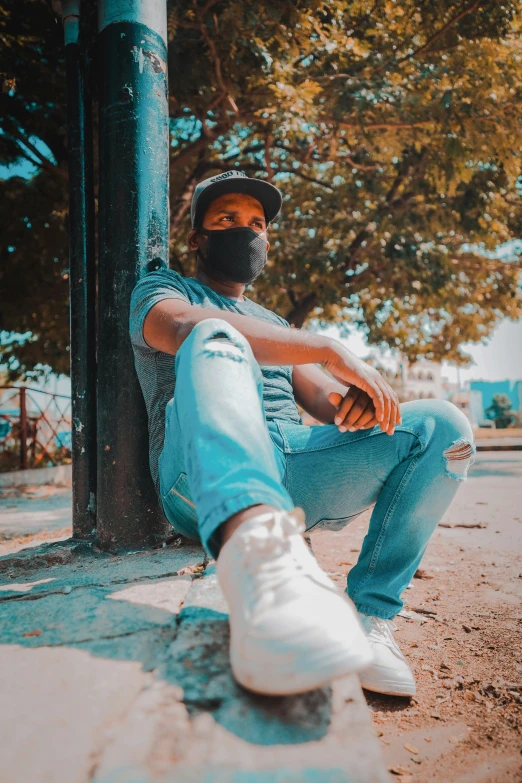 a man with a beard sitting on a pole