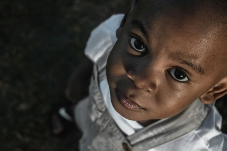 an image of a little boy that is looking up