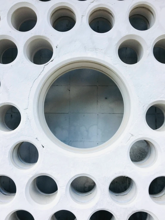 a circular window that is on the wall