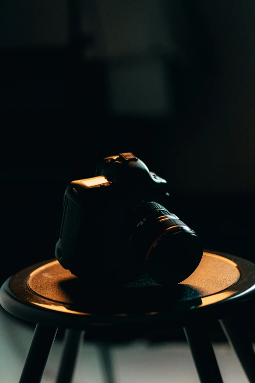 a black camera sitting on a metal table