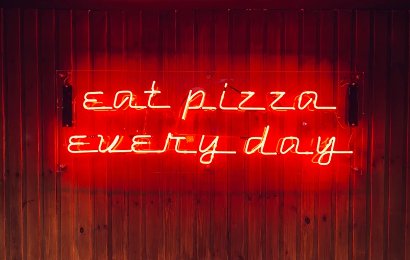 a neon sign that reads eat pizza every day