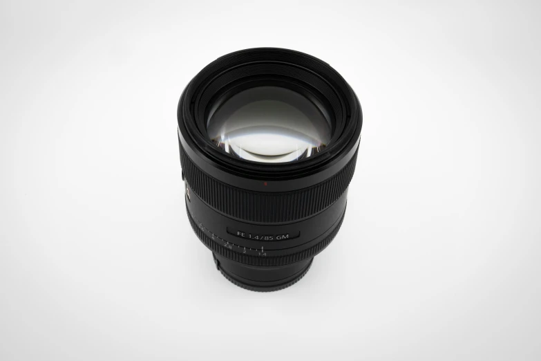 camera lens on white background with a lens cap