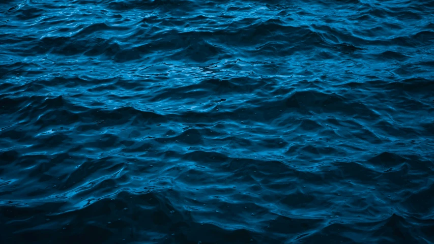 waves in the ocean from an airplane at night