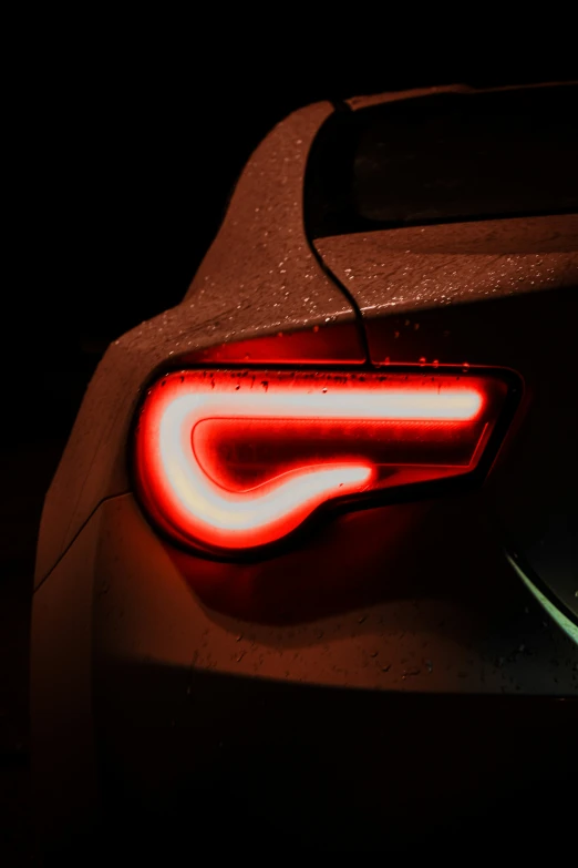 the taillight of the sport car is visible