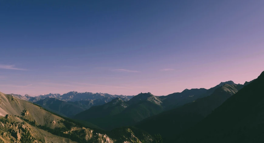 a view of some mountains from the top