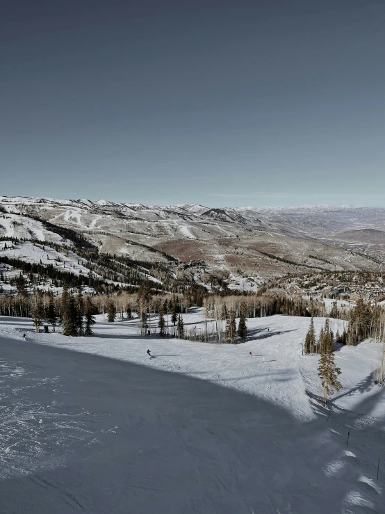 a large expanse of snow in the middle of the ground