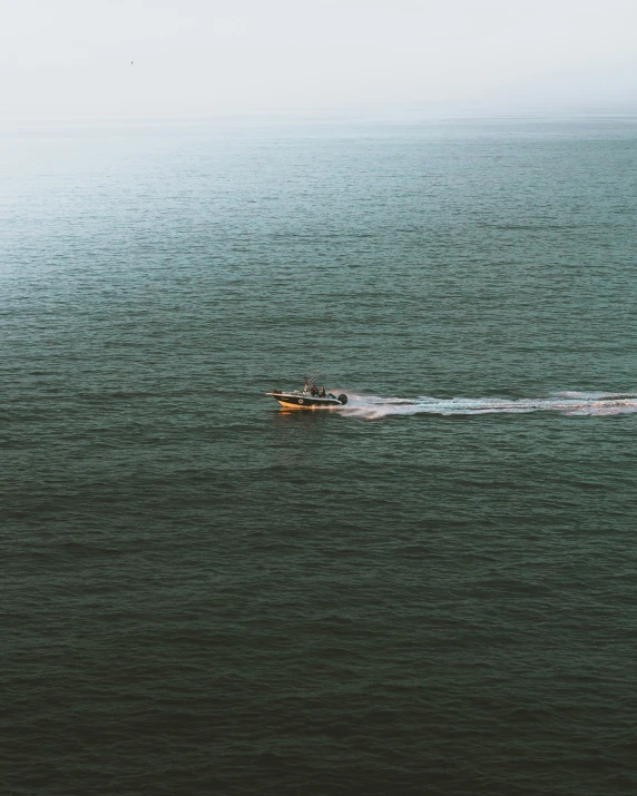 there is an image of boat in the middle of the water