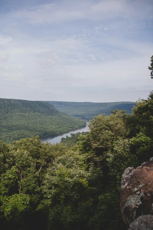 the water flows down the green valley below