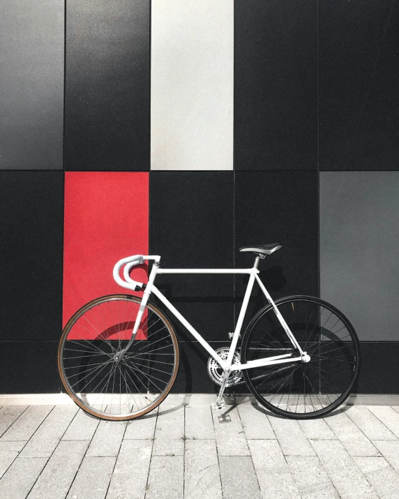 a bike leaning against a wall in front of a building