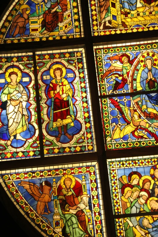 an ornate stained glass window in the nave