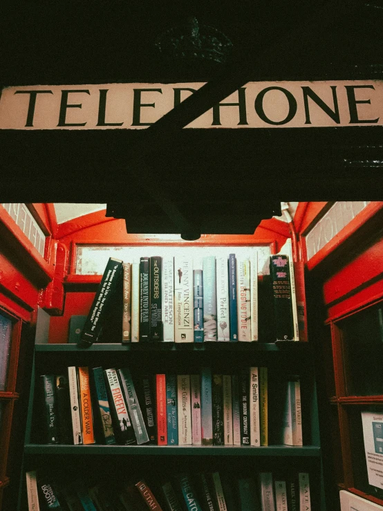 there is a book shelf that has a lot of books on it