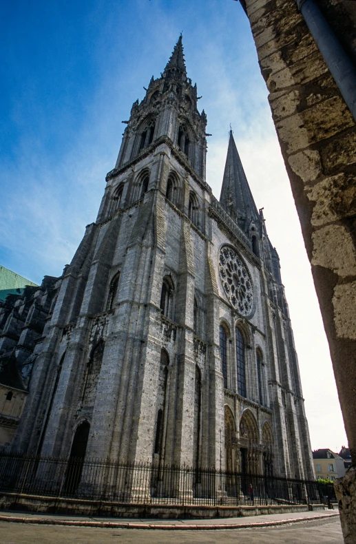 a large church that is standing next to a gate