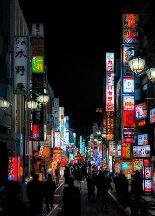 a city street filled with lots of buildings and signs