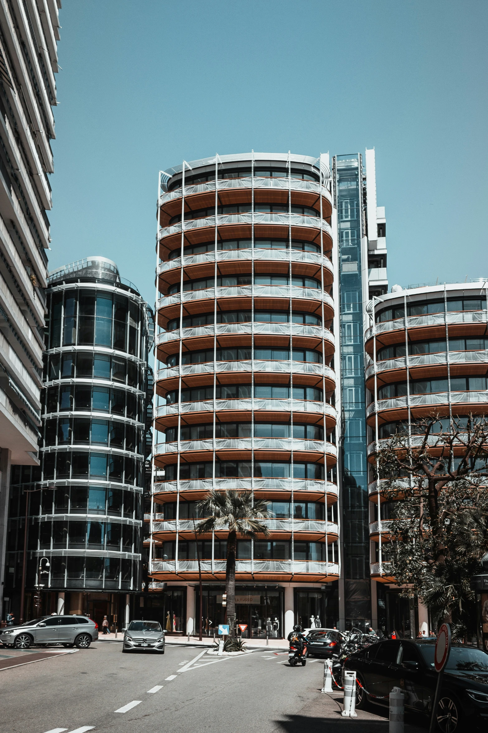 a view of two office buildings from the parking lot