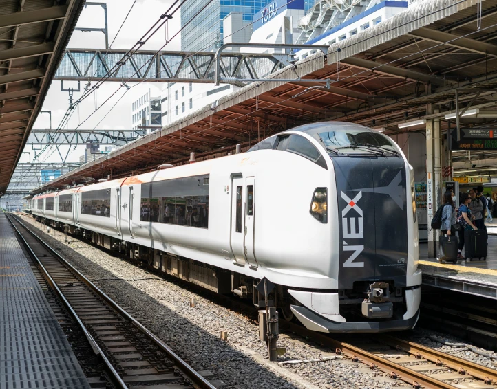 a modern train is arriving at an empty train station