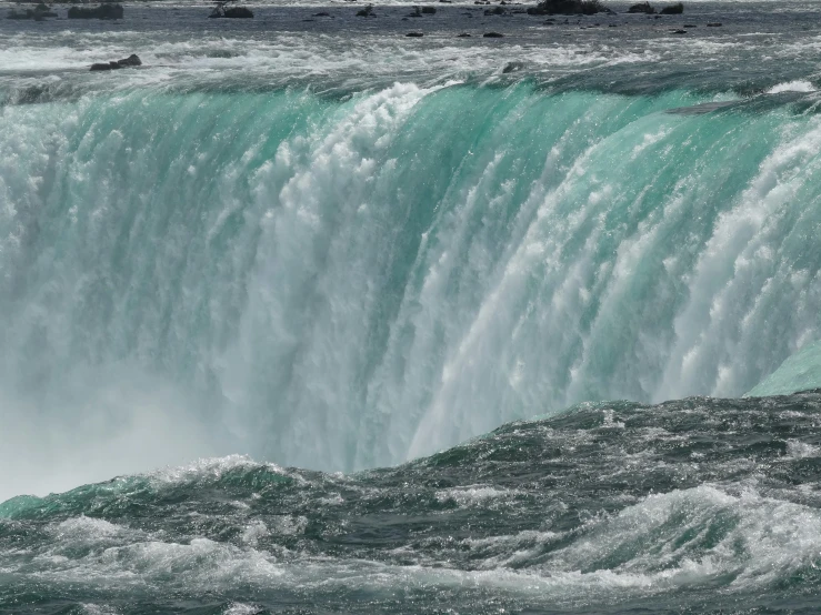 a person standing on top of a waterfall