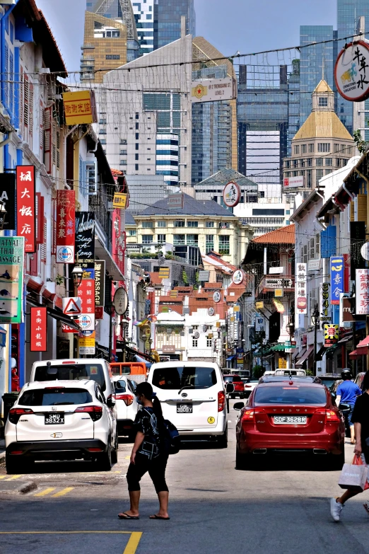 people walking down a busy street in the city