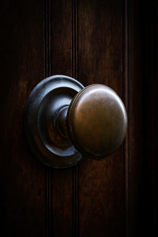 a door  on a wood door with a dark background