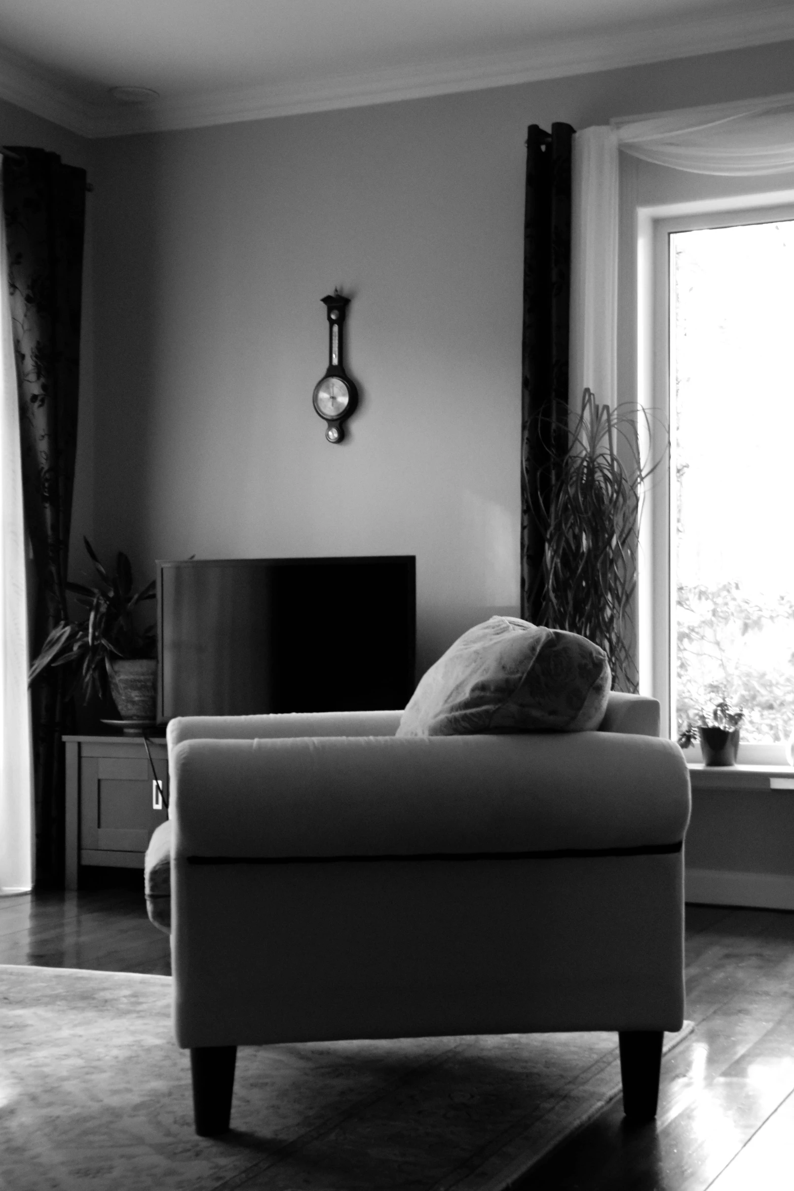 a living room with a couch and large window