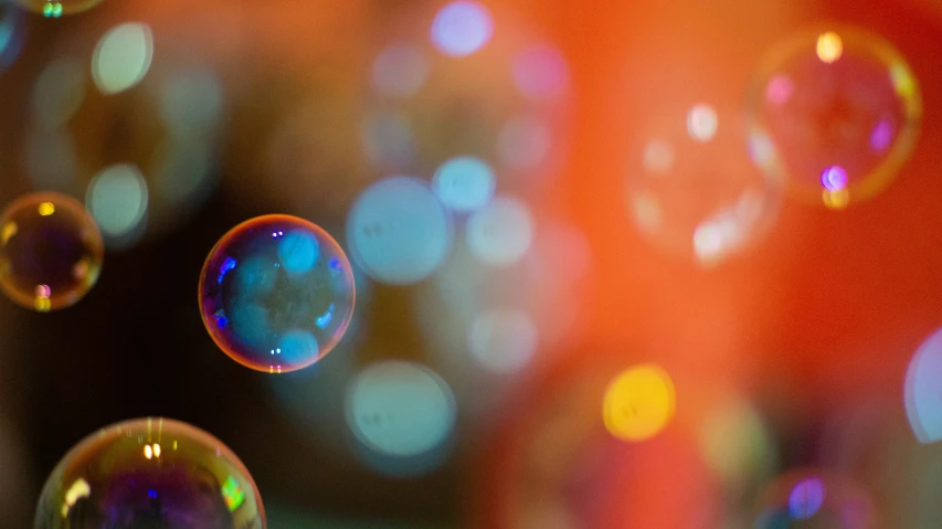 a close up image of soap bubbles on the window