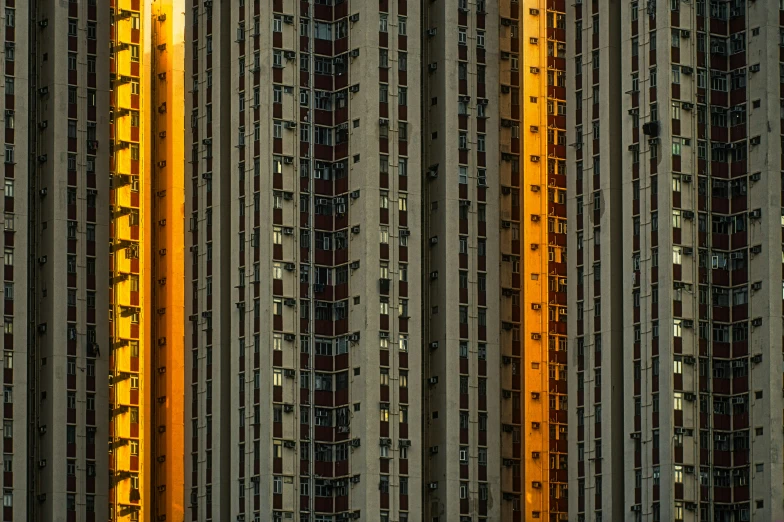 tall buildings with a yellow street light at one end