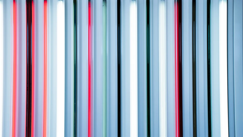 a wall with different shades of colored bars on it