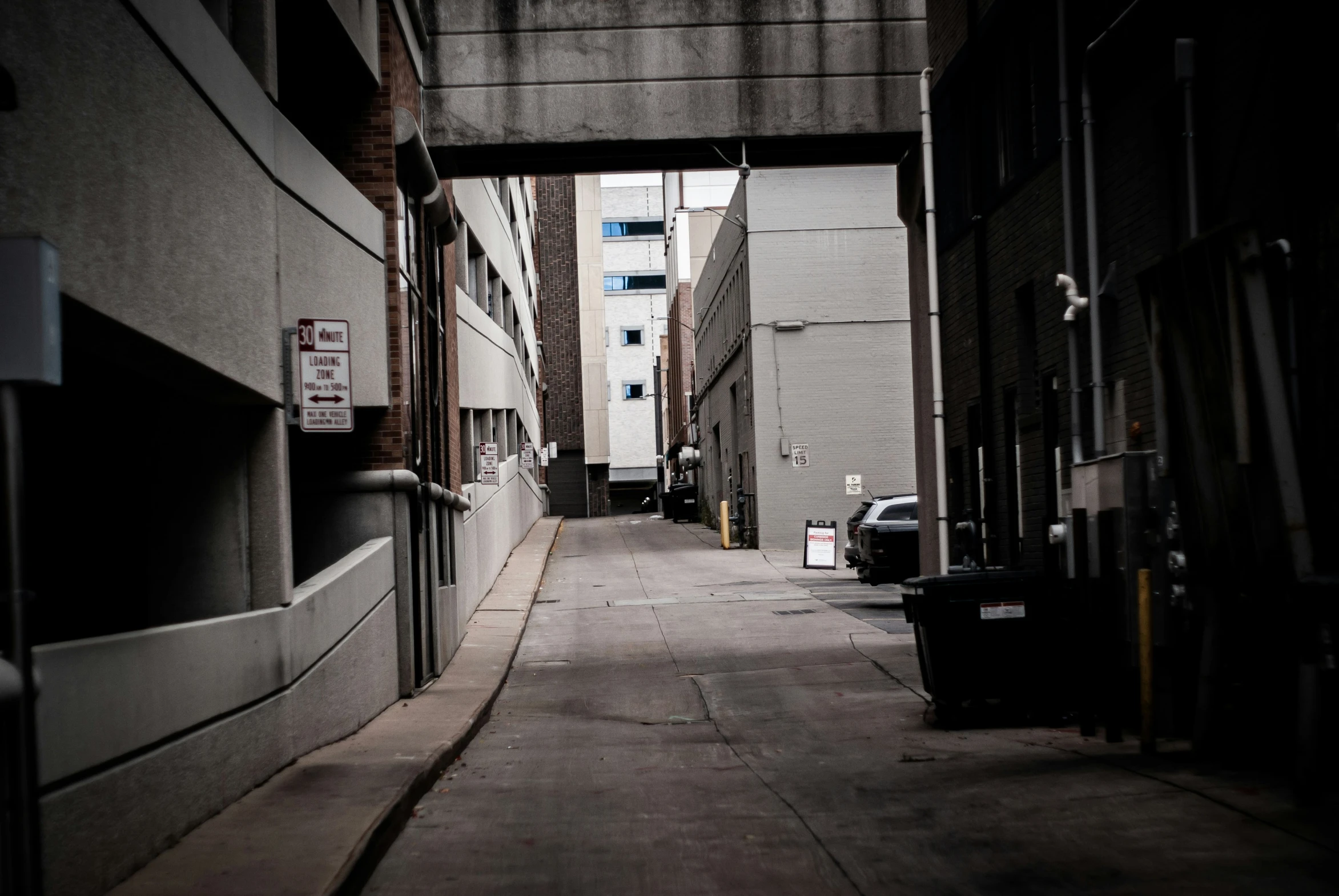 this narrow alley has two traffic lights on both sides