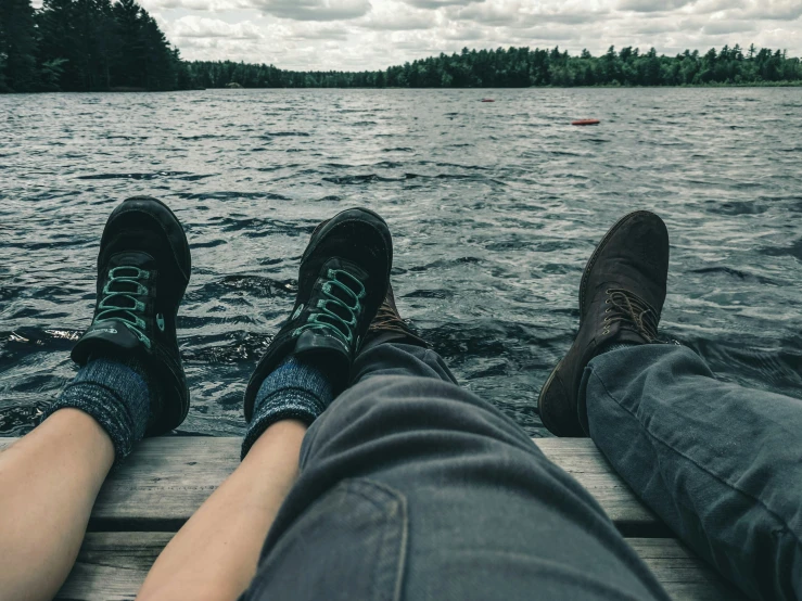 two persons sitting on the back of a boat