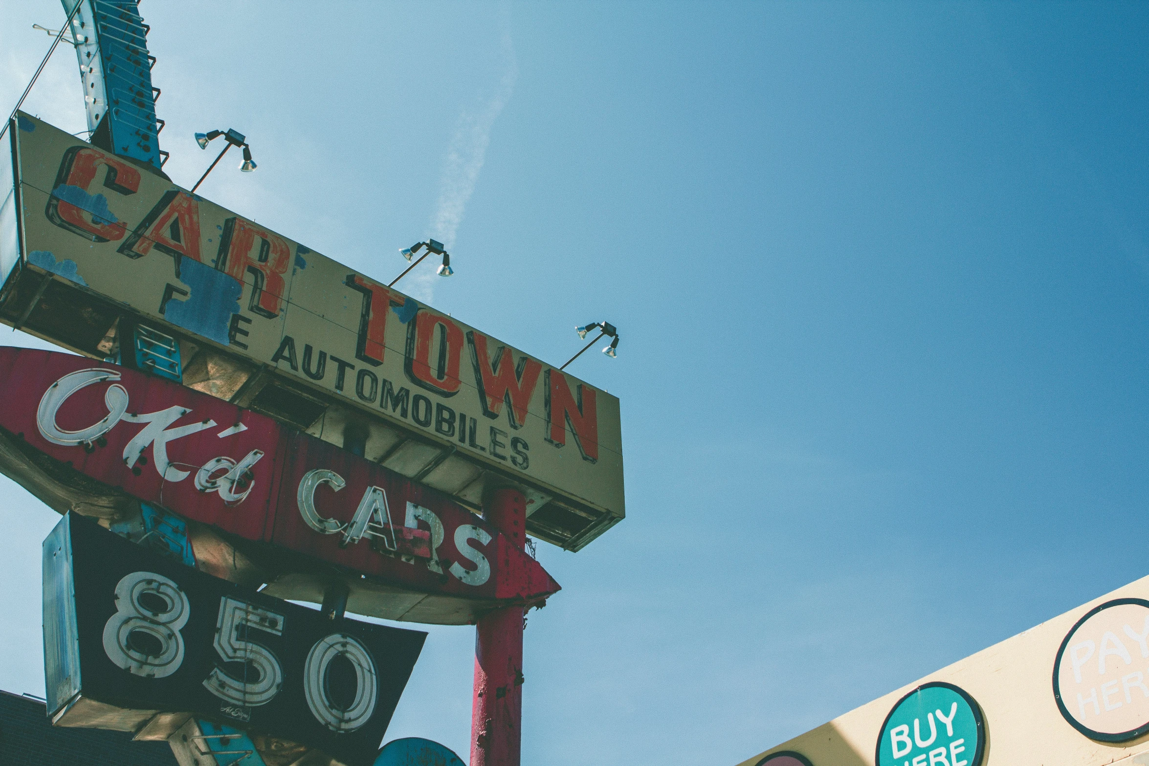 a colorful sign is shown against the sky