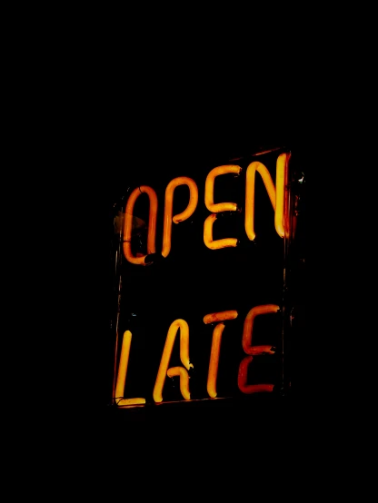 an open sign is seen against a black background